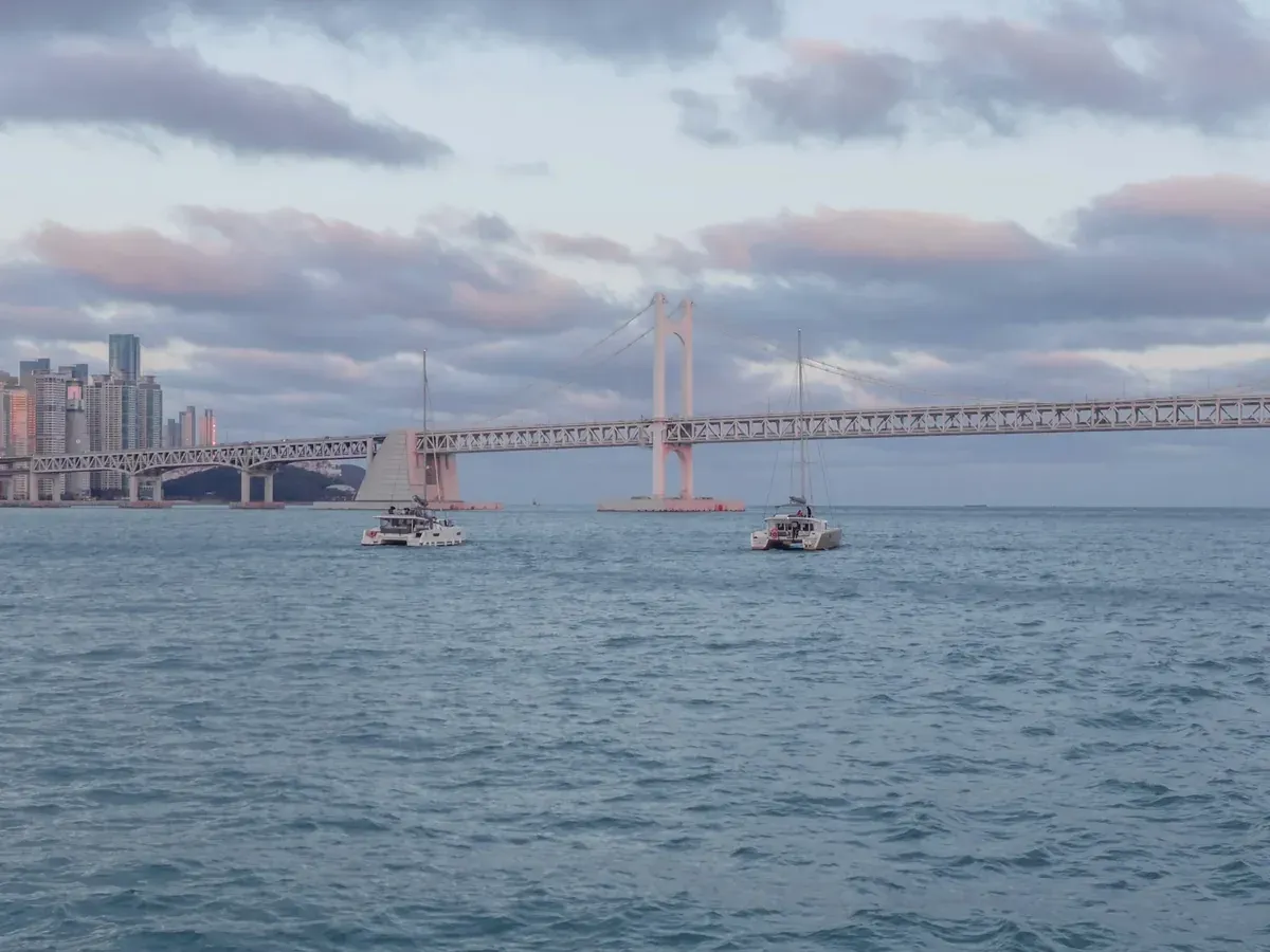 Boat passing beneath Gwangan Bridge