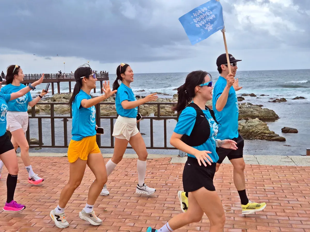 Group running along the Busan coast